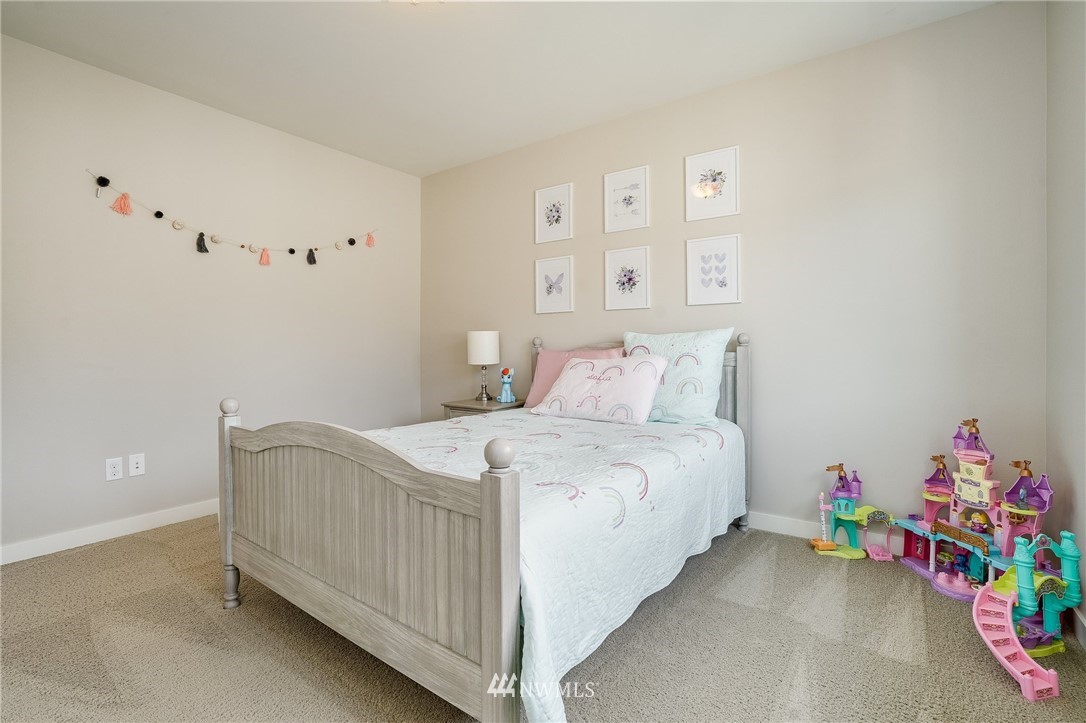 3408 223rd Place Southeast Bothell, WA 98021 - Photo 31 of 40 a bedroom with a bed and a window