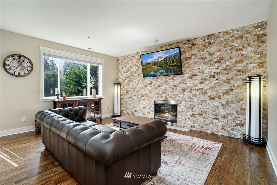 3408 223rd Place Southeast Bothell, WA 98021 - Photo 5 of 40 a living room with furniture and a fireplace