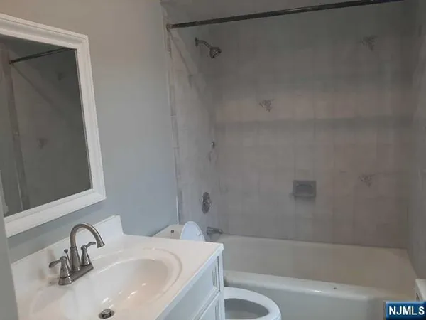a bathroom with a sink and a bathtub