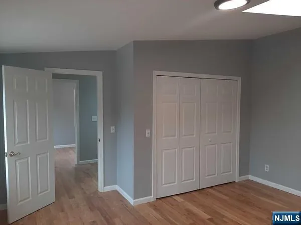 an empty room with wooden floor