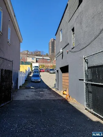 a view of a house with a street