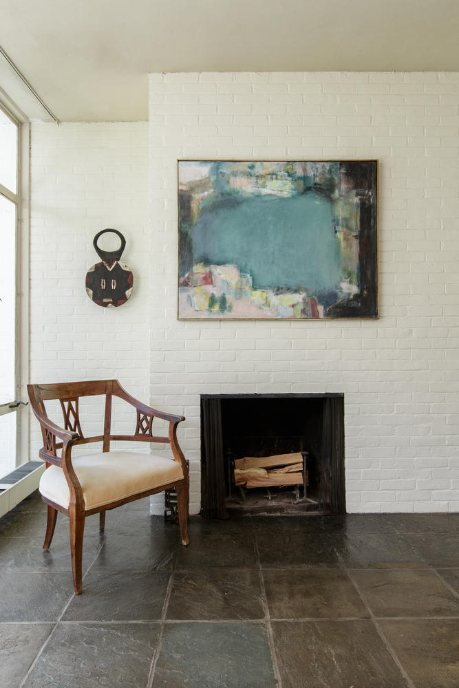 90 Lambert Road New Canaan, CT 06840 - Photo 12 of 28 a living room with furniture and a fireplace