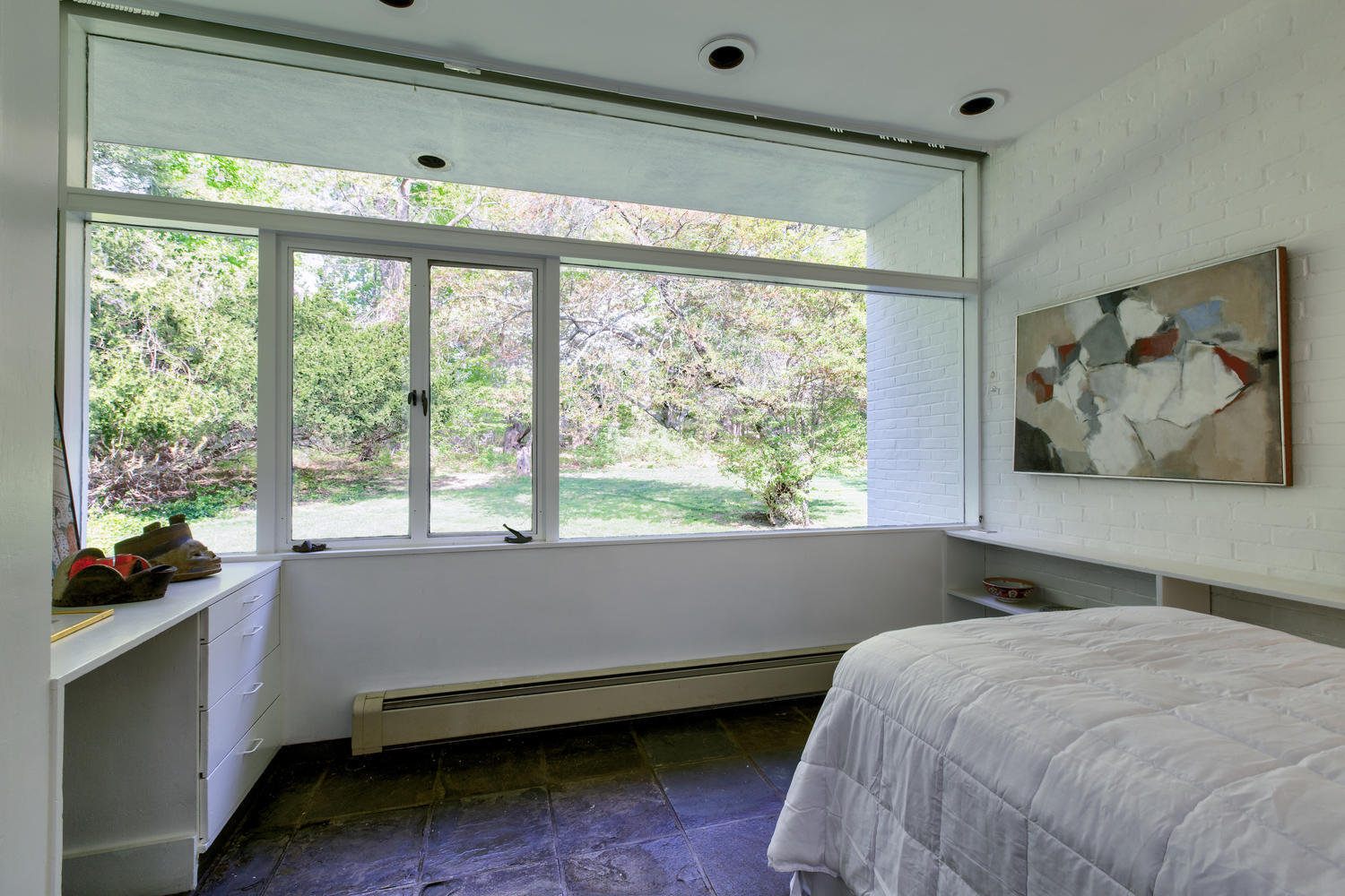 90 Lambert Road New Canaan, CT 06840 - Photo 17 of 28 a bedroom with a bed and a large window