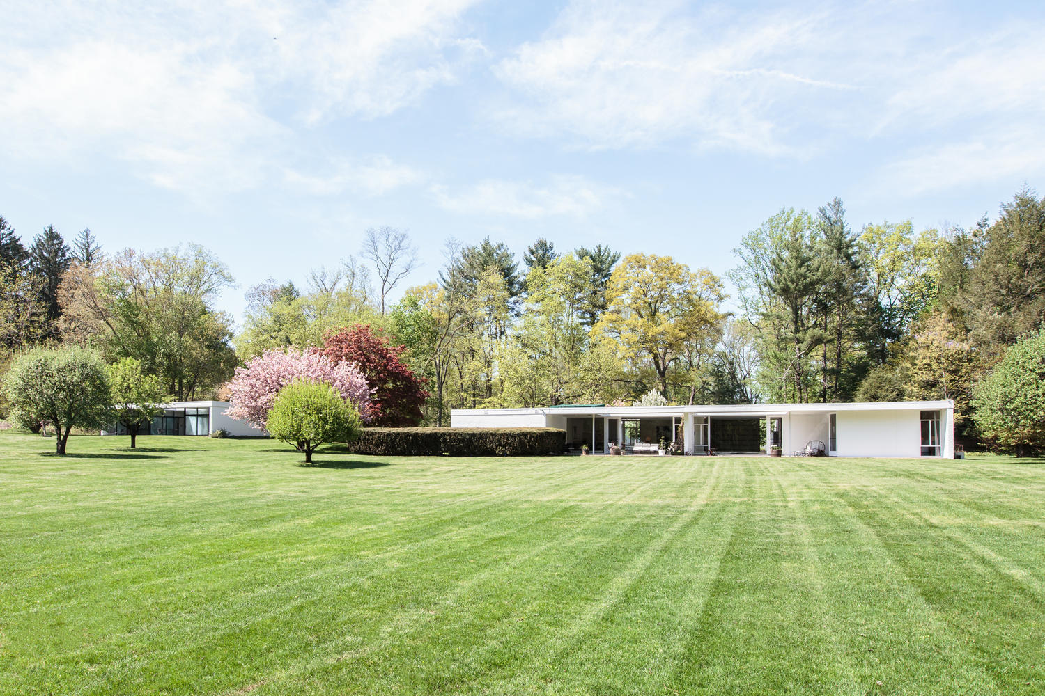 90 Lambert Road New Canaan, CT 06840 - Photo 20 of 28 a house view with swimming pool in front of it
