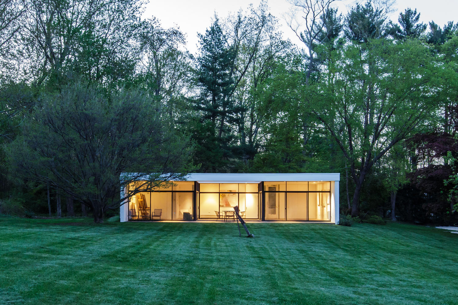 90 Lambert Road New Canaan, CT 06840 - Photo 22 of 28 front view of a house with a yard