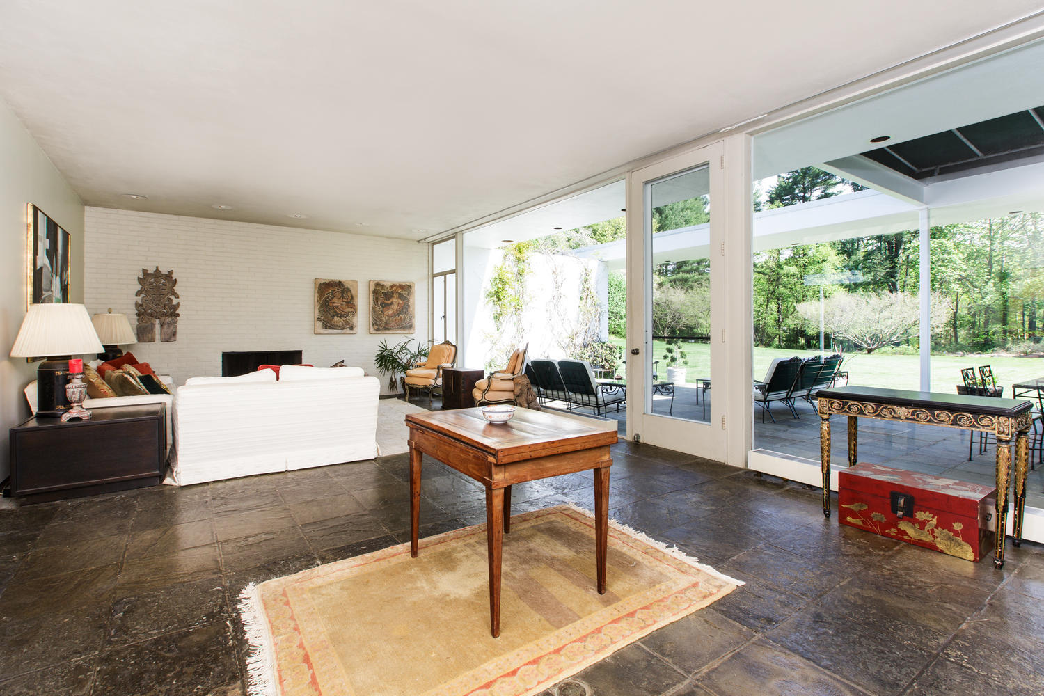 90 Lambert Road New Canaan, CT 06840 - Photo 9 of 28 a living room with furniture a table and a large window