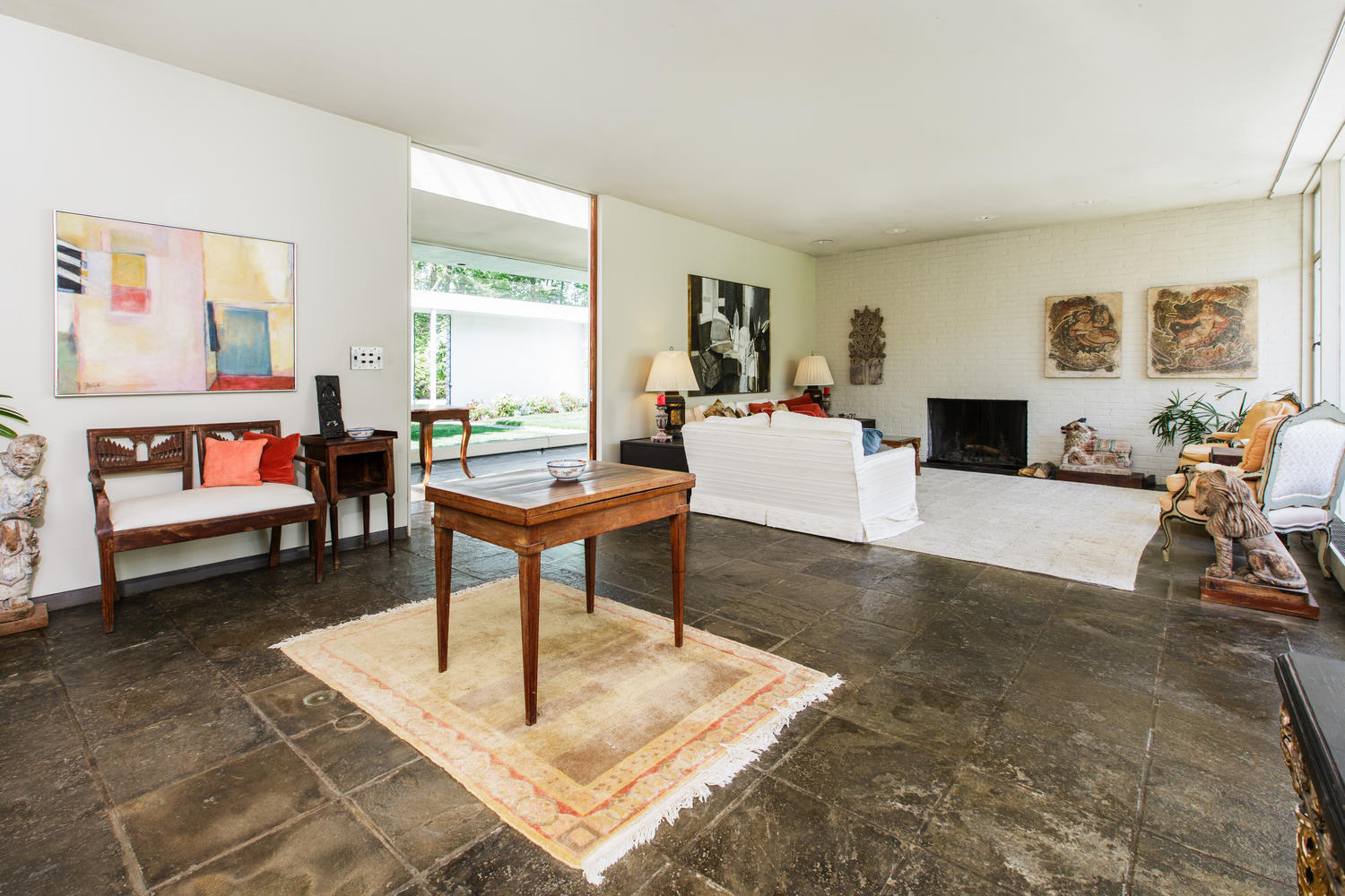 90 Lambert Road New Canaan, CT 06840 - Photo 10 of 28 a living room with furniture a fireplace and a window