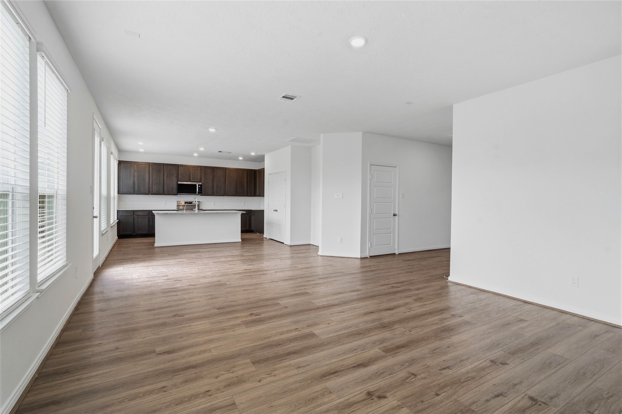 2503 Spruce Hl Road Beasley, TX 77417 - Photo 10 of 31 An entertainer’s dream! The expansive, open-concept main floor flows beautifully from room to room, keeping you connected to guests whether you're cooking in the kitchen or relaxing in the living room.