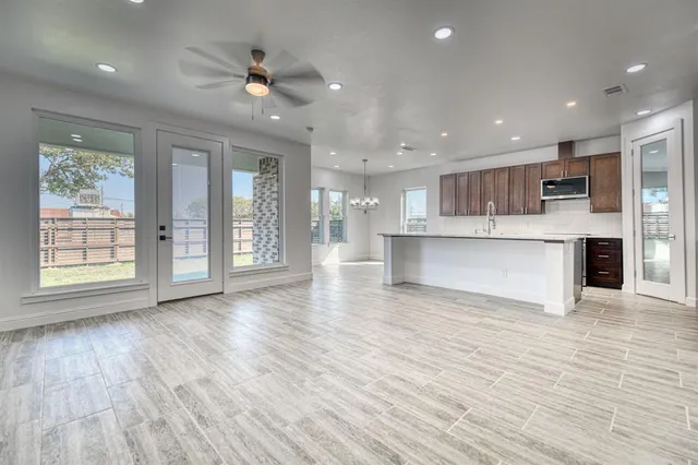 a view of kitchen with cabinets and wooden floor