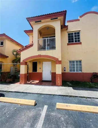 a front view of a house with swimming pool