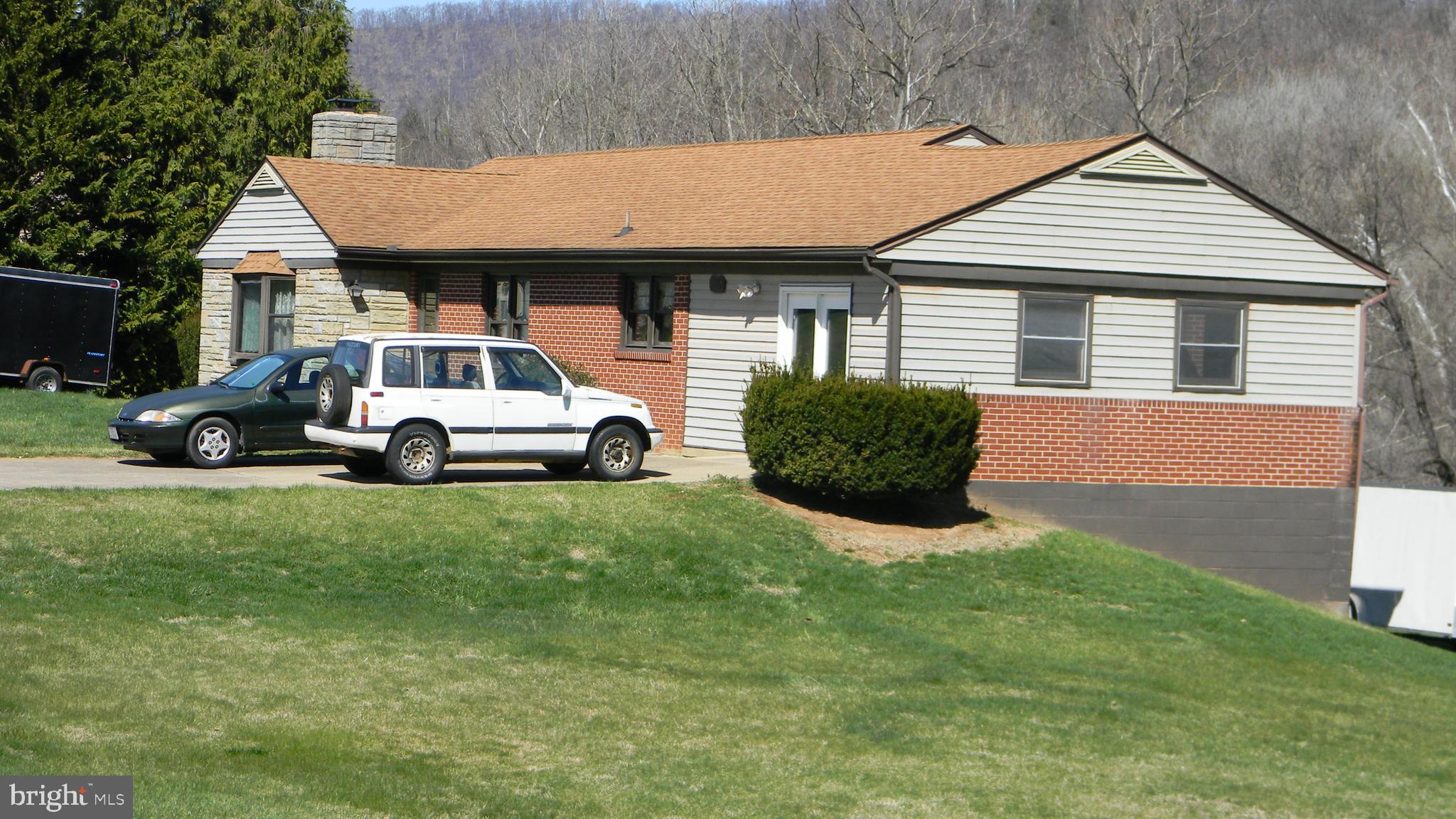 6688 Brocks Gap Road Broadway, VA 22815 - Photo 2 of 81 a front view of a house with a yard and trees
