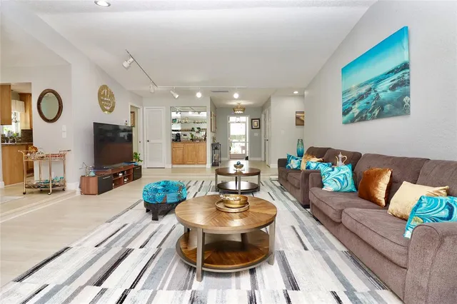 a kitchen with stainless steel appliances granite countertop a refrigerator and a stove