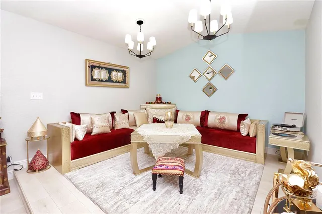 a room with pool table and windows