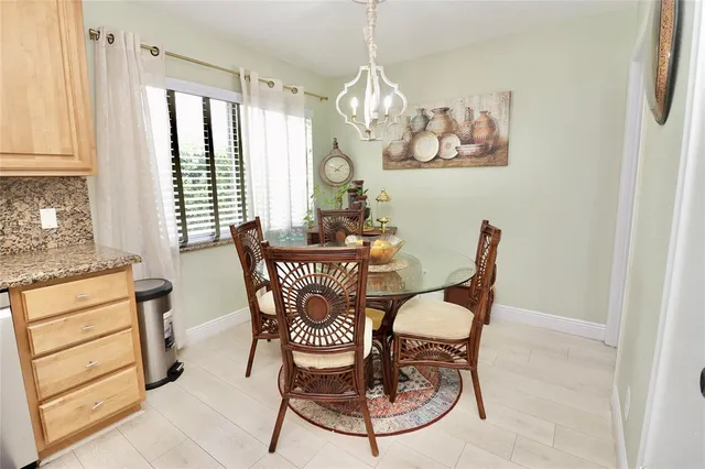 a view of a dining room with furniture and a window