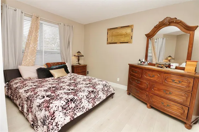 an aerial view of a house with yard