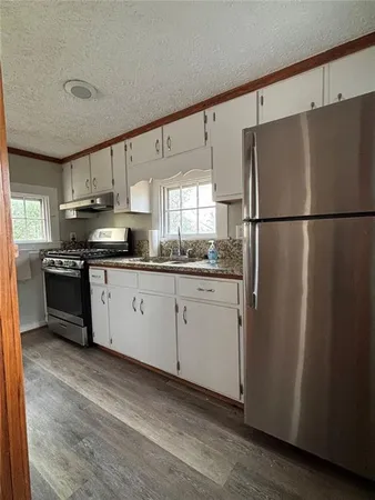 a kitchen with a refrigerator a sink and dishwasher