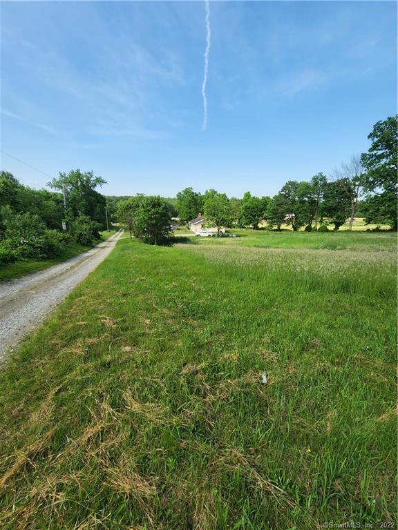 98 Kahn Road Franklin, CT 06254 - Photo 1 of 1 a view of a grassy field with trees