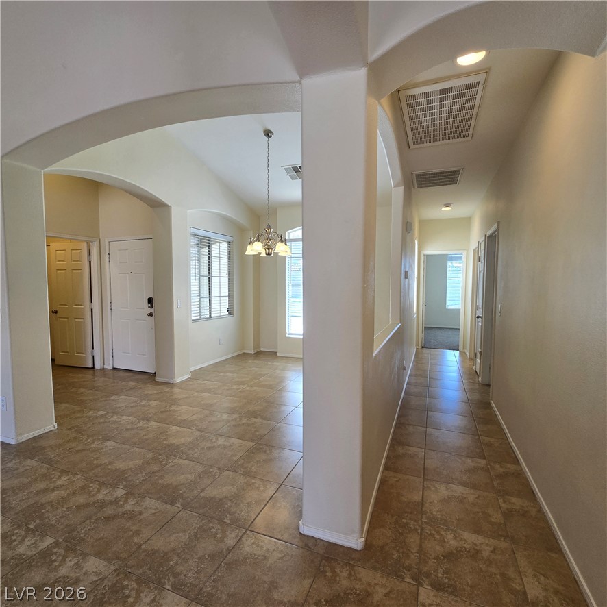 9234 Kingston Road Henderson, NV 89074 - Photo 20 of 38 Enter into a bright, open space featuring a tiled entryway and elegant archways.