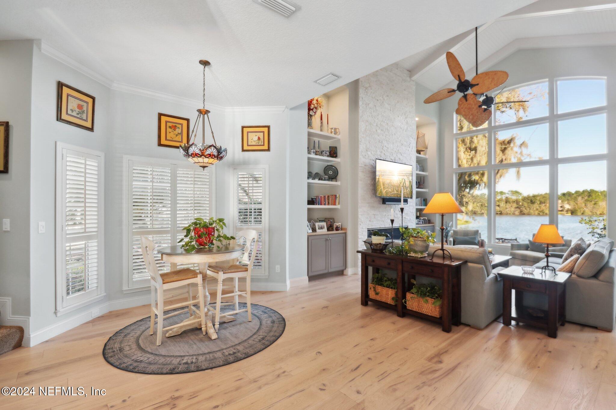 240 Pinehurst Pointe Drive St. Augustine, FL 32092 - Photo 12 of 70 a view of a livingroom with furniture a couch and wooden floor