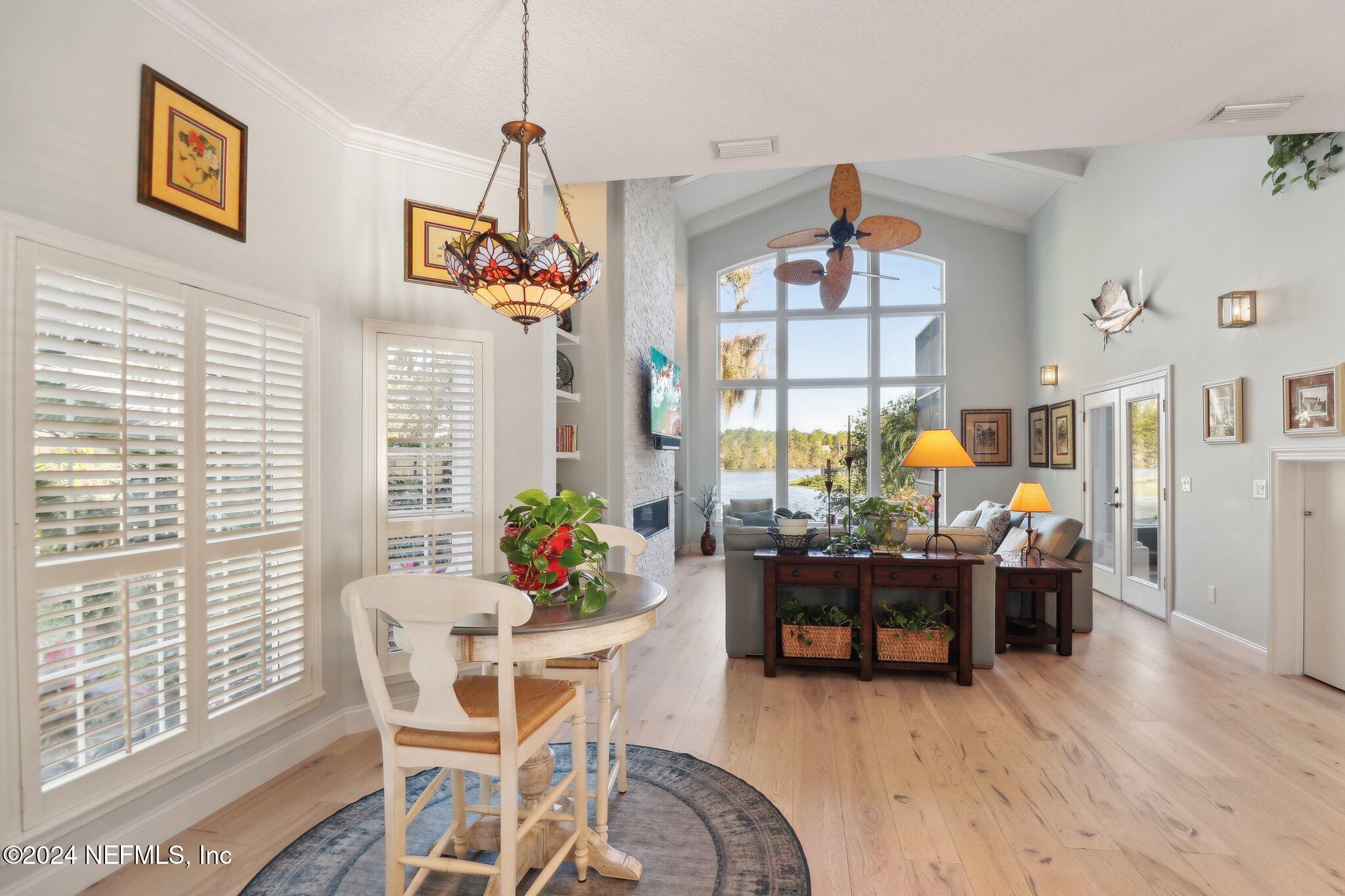 240 Pinehurst Pointe Drive St. Augustine, FL 32092 - Photo 13 of 70 a dining room with furniture and wooden floor