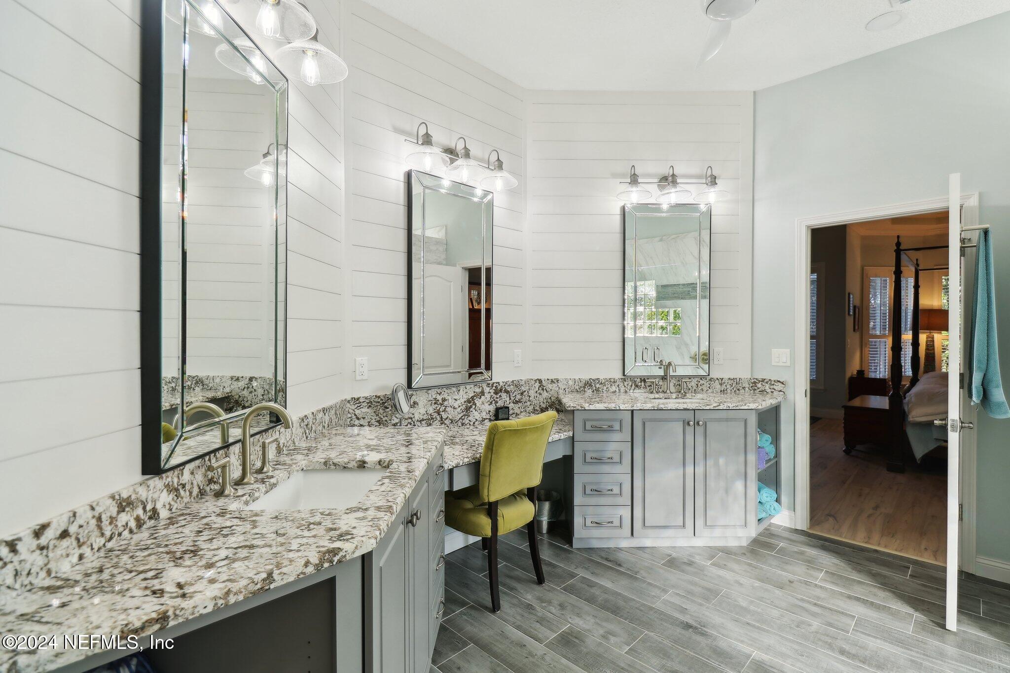 240 Pinehurst Pointe Drive St. Augustine, FL 32092 - Photo 29 of 70 a bathroom with a granite countertop sink and a mirror