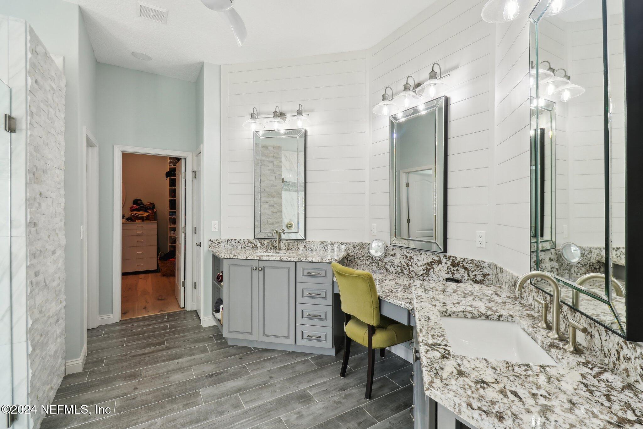 240 Pinehurst Pointe Drive St. Augustine, FL 32092 - Photo 30 of 70 a bathroom with a granite countertop sink and a mirror