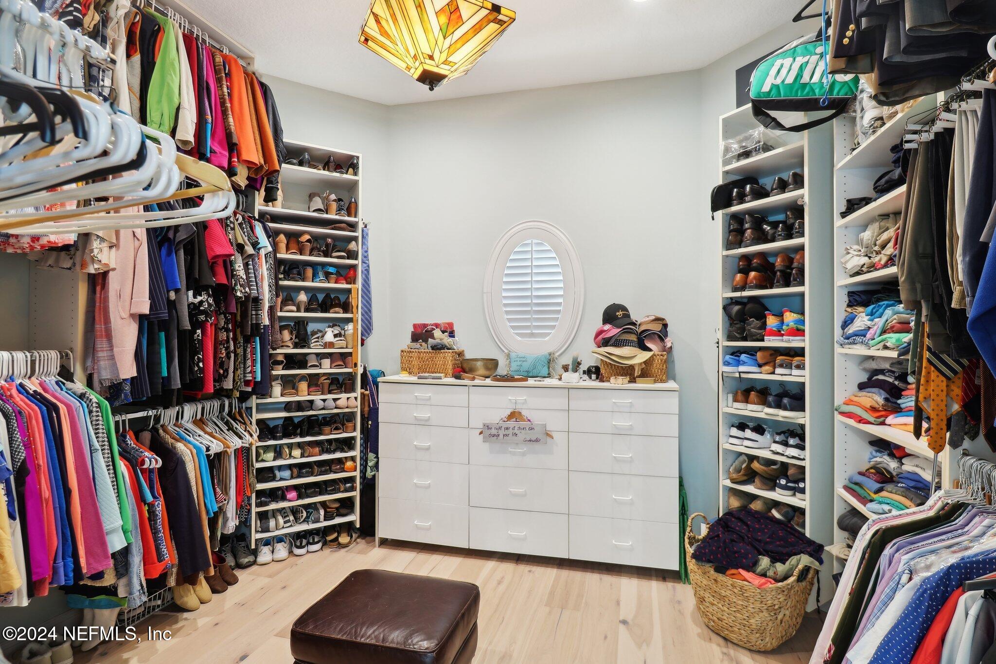 240 Pinehurst Pointe Drive St. Augustine, FL 32092 - Photo 31 of 70 a view of walk in closet with clothes and shoes