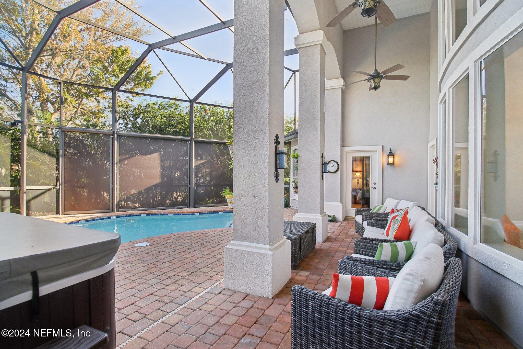240 Pinehurst Pointe Drive St. Augustine, FL 32092 - Photo 45 of 70 a living room with furniture and a yard