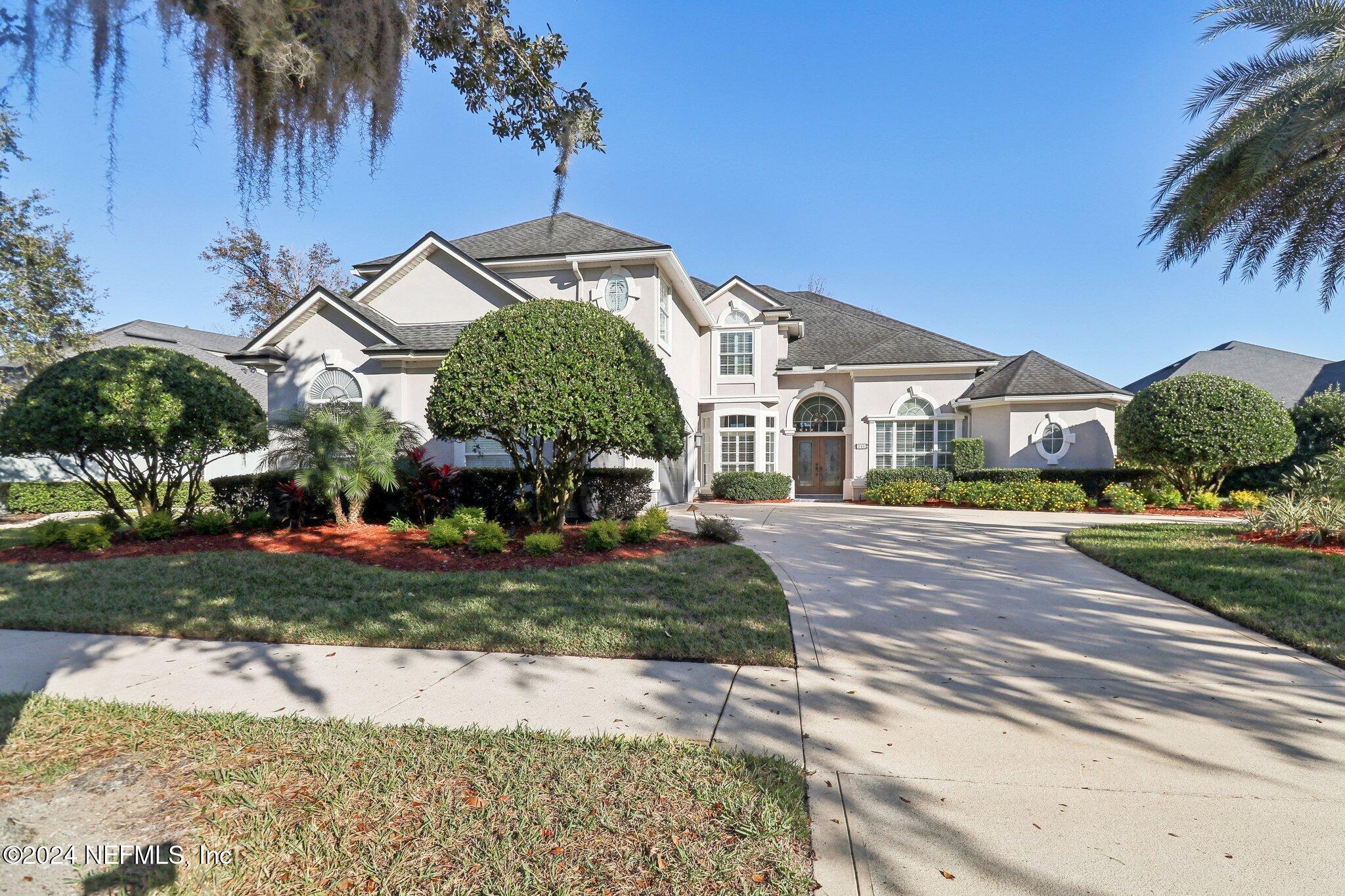 240 Pinehurst Pointe Drive St. Augustine, FL 32092 - Photo 55 of 70 a front view of a house with garden