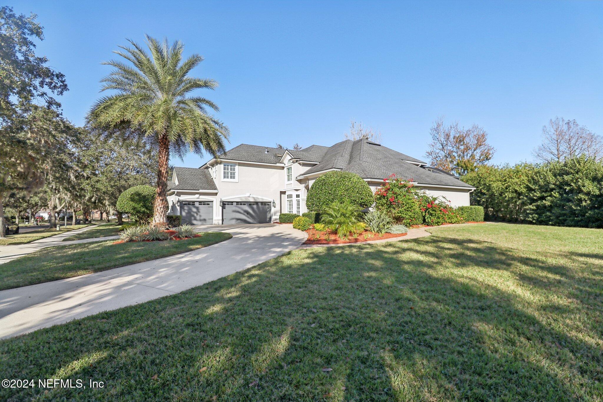 240 Pinehurst Pointe Drive St. Augustine, FL 32092 - Photo 56 of 70 a view of a street with a building in the background