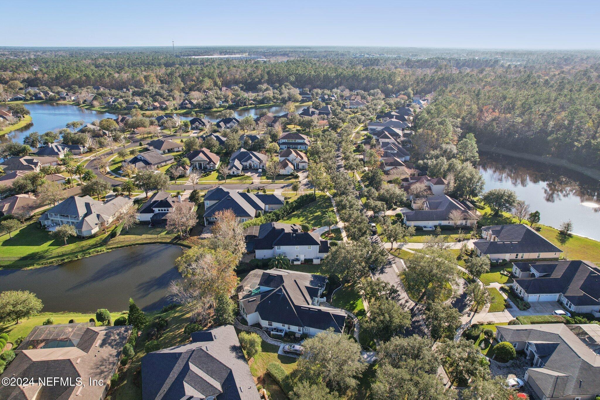 240 Pinehurst Pointe Drive St. Augustine, FL 32092 - Photo 63 of 70 an aerial view of residential building and trees