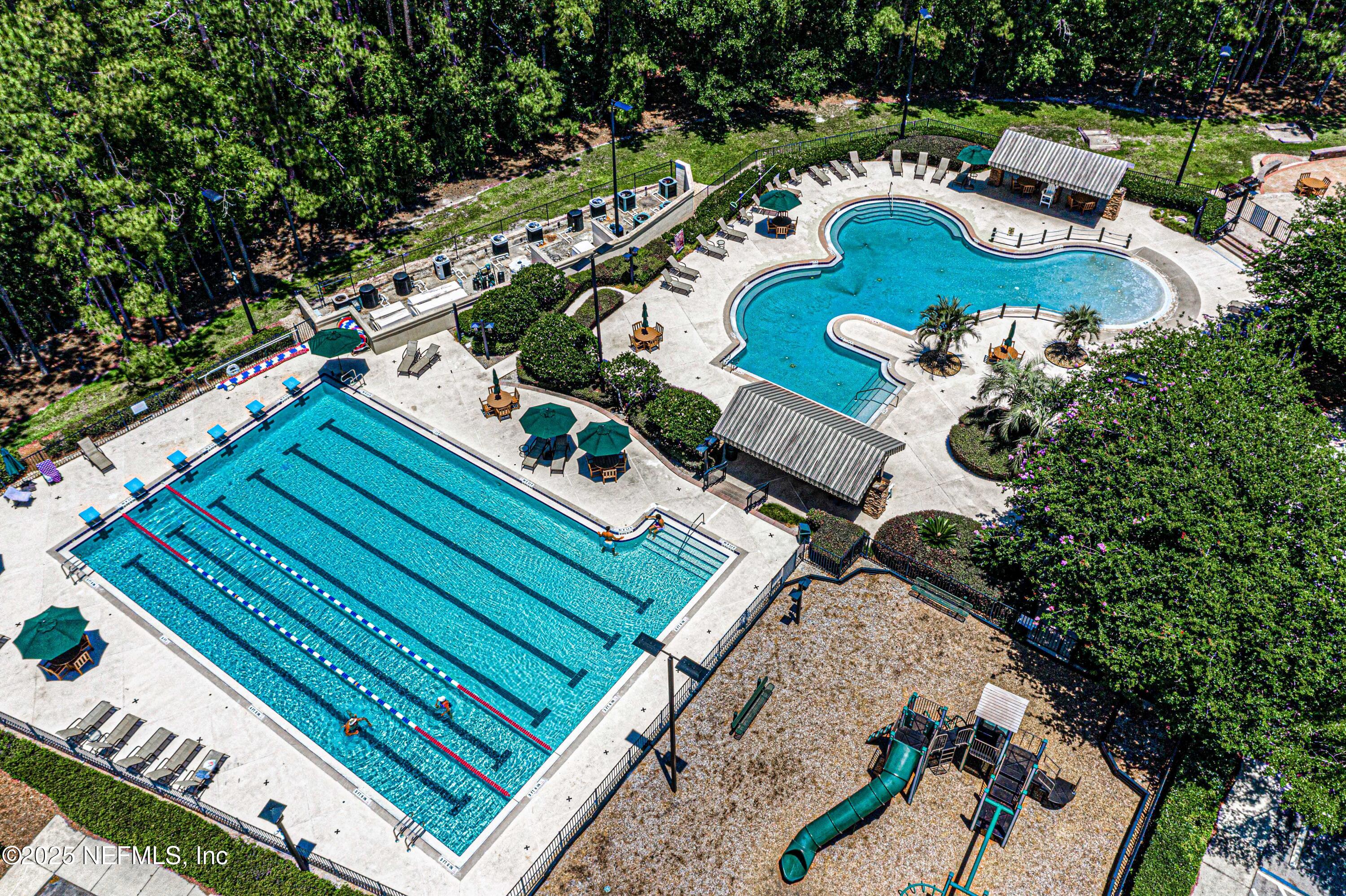 240 Pinehurst Pointe Drive St. Augustine, FL 32092 - Photo 70 of 70 an aerial view of a house a yard and outdoor seating
