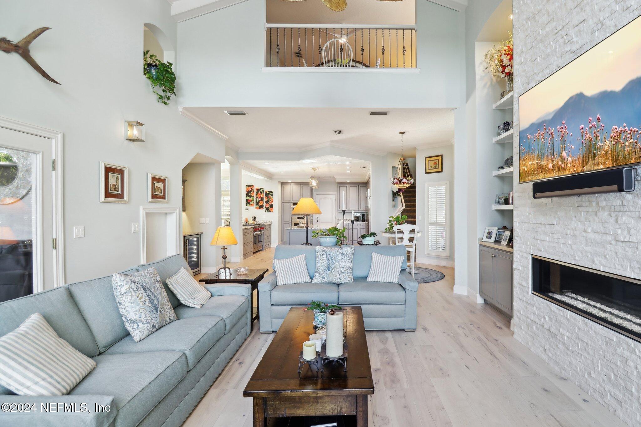 240 Pinehurst Pointe Drive St. Augustine, FL 32092 - Photo 8 of 70 a living room with furniture and a fireplace