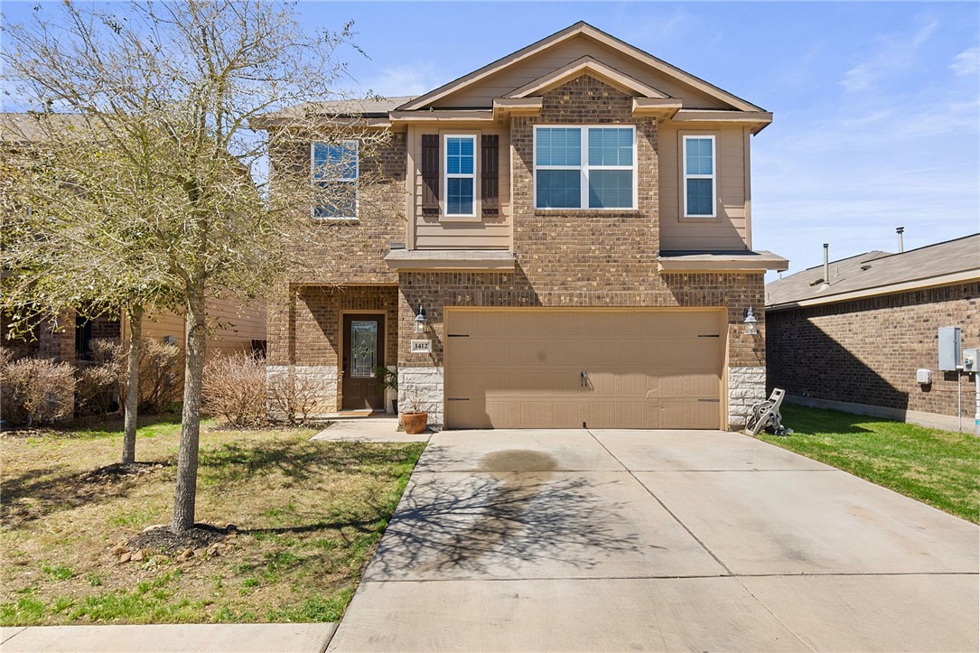 1412 Treeta Trail Kyle, TX 78640 - Photo 1 of 1 a front view of a house with garden