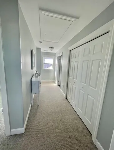 a view of a hallway with a furniture