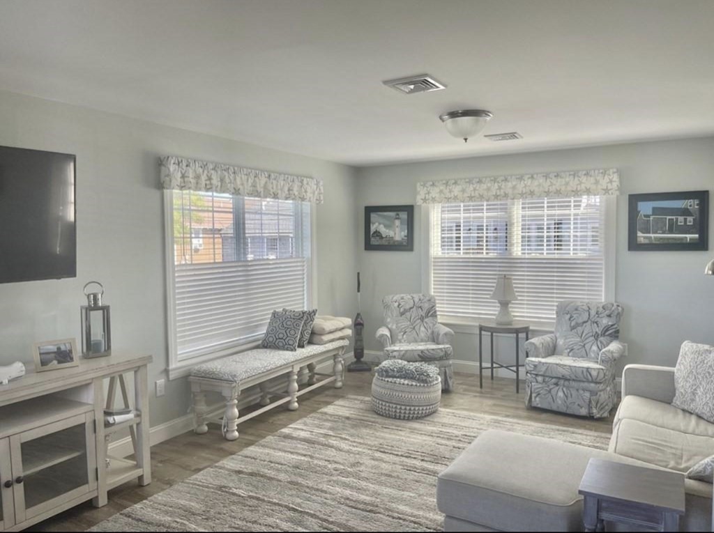 15 10th Avenue Scituate, MA 02066 - Photo 7 of 21 a living room with furniture and a fireplace