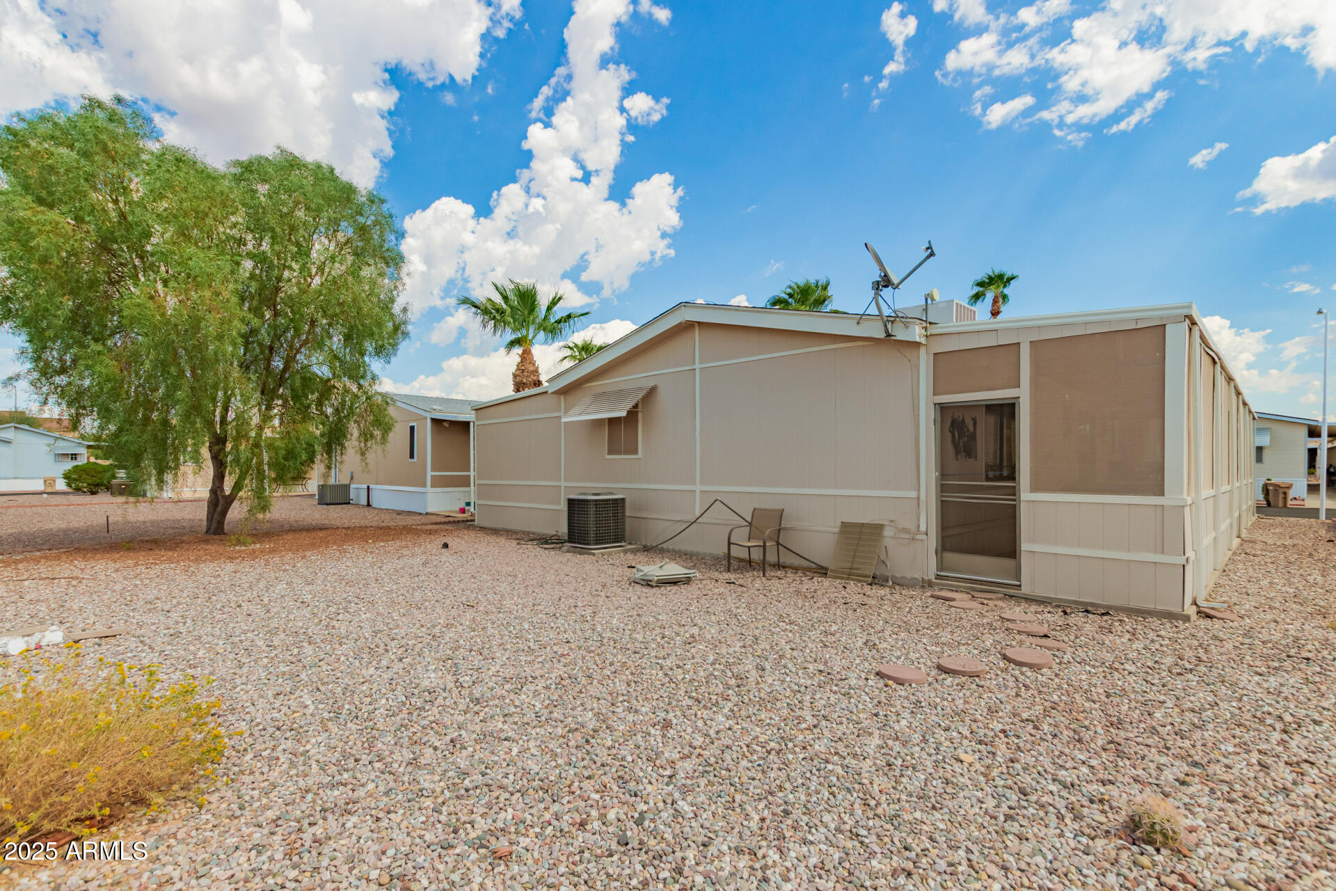 301 South Signal Butte Road, Unit 706 Apache Junction, AZ 85120 - Photo 39 of 51 a view of a house with a yard