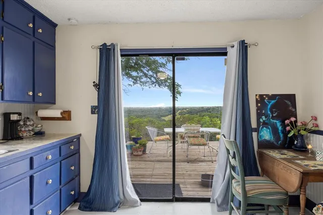a view of a living room and a floor to ceiling window