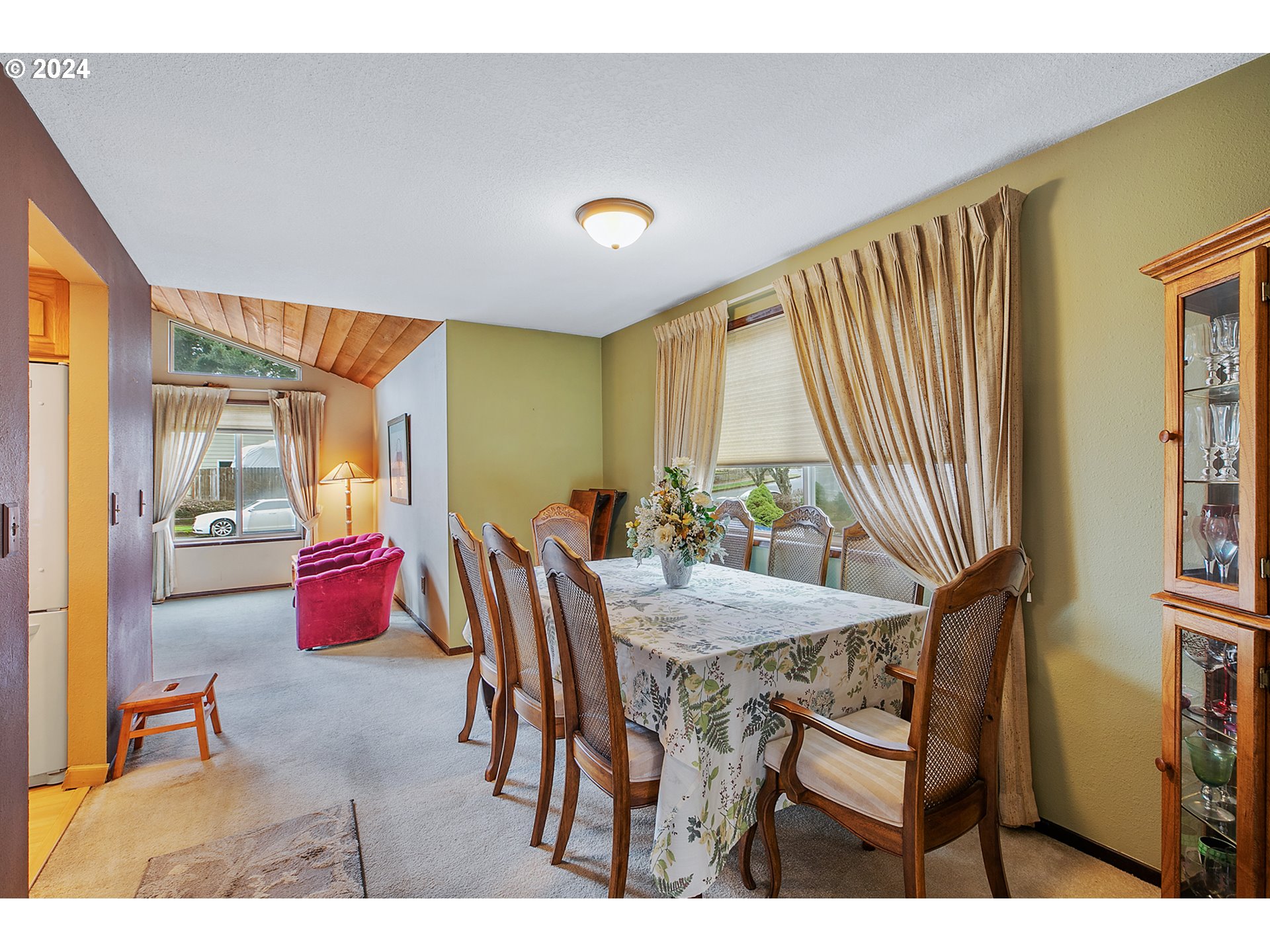 321 Northeast Scott Drive Gresham, OR 97030 - Photo 14 of 48 a view of a dining room with furniture and a large window