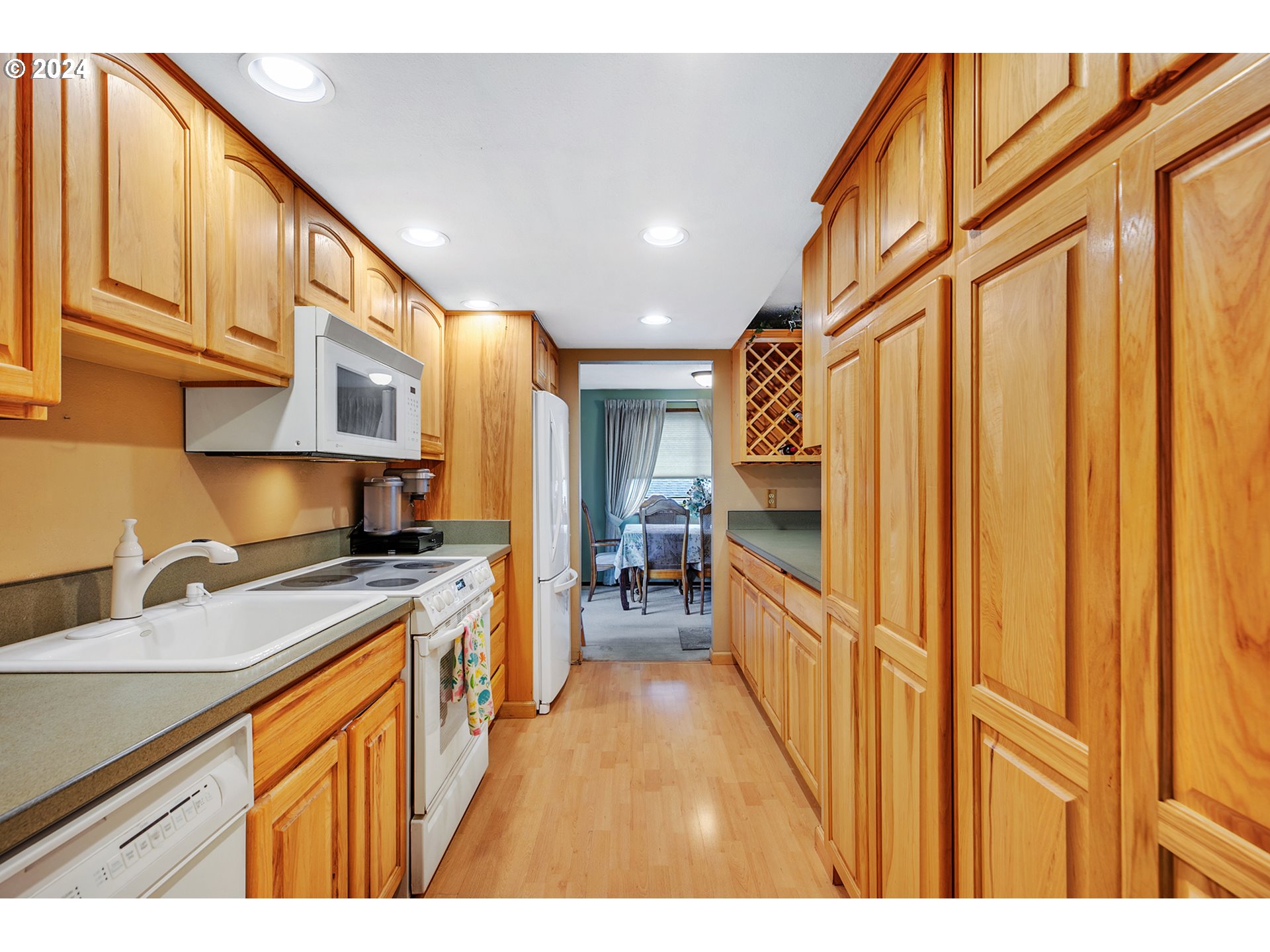 321 Northeast Scott Drive Gresham, OR 97030 - Photo 15 of 48 a kitchen with stainless steel appliances granite countertop a refrigerator a stove and a sink