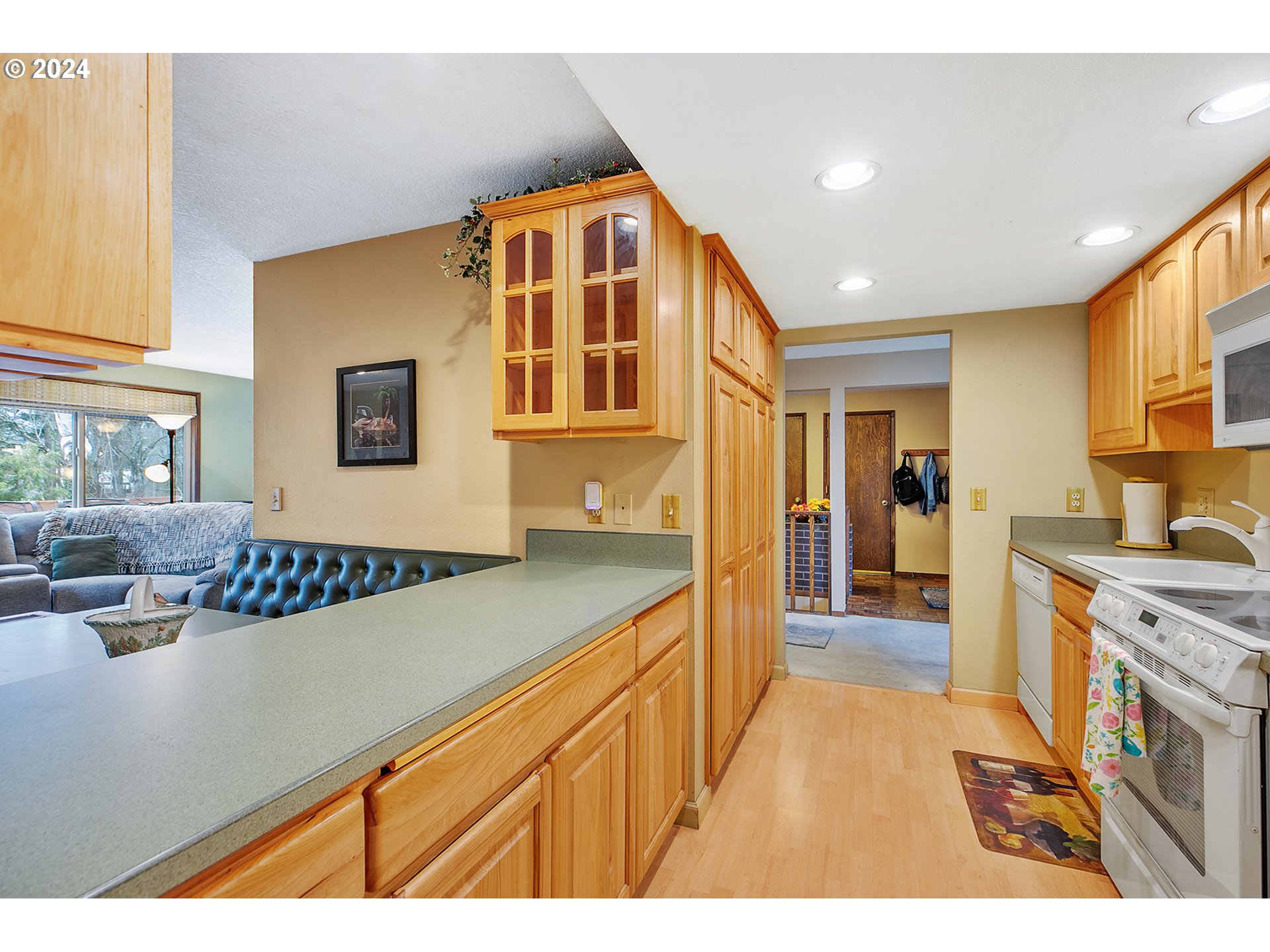 321 Northeast Scott Drive Gresham, OR 97030 - Photo 17 of 48 a view of a kitchen with kitchen island granite countertop a sink appliances cabinets and a counter top space