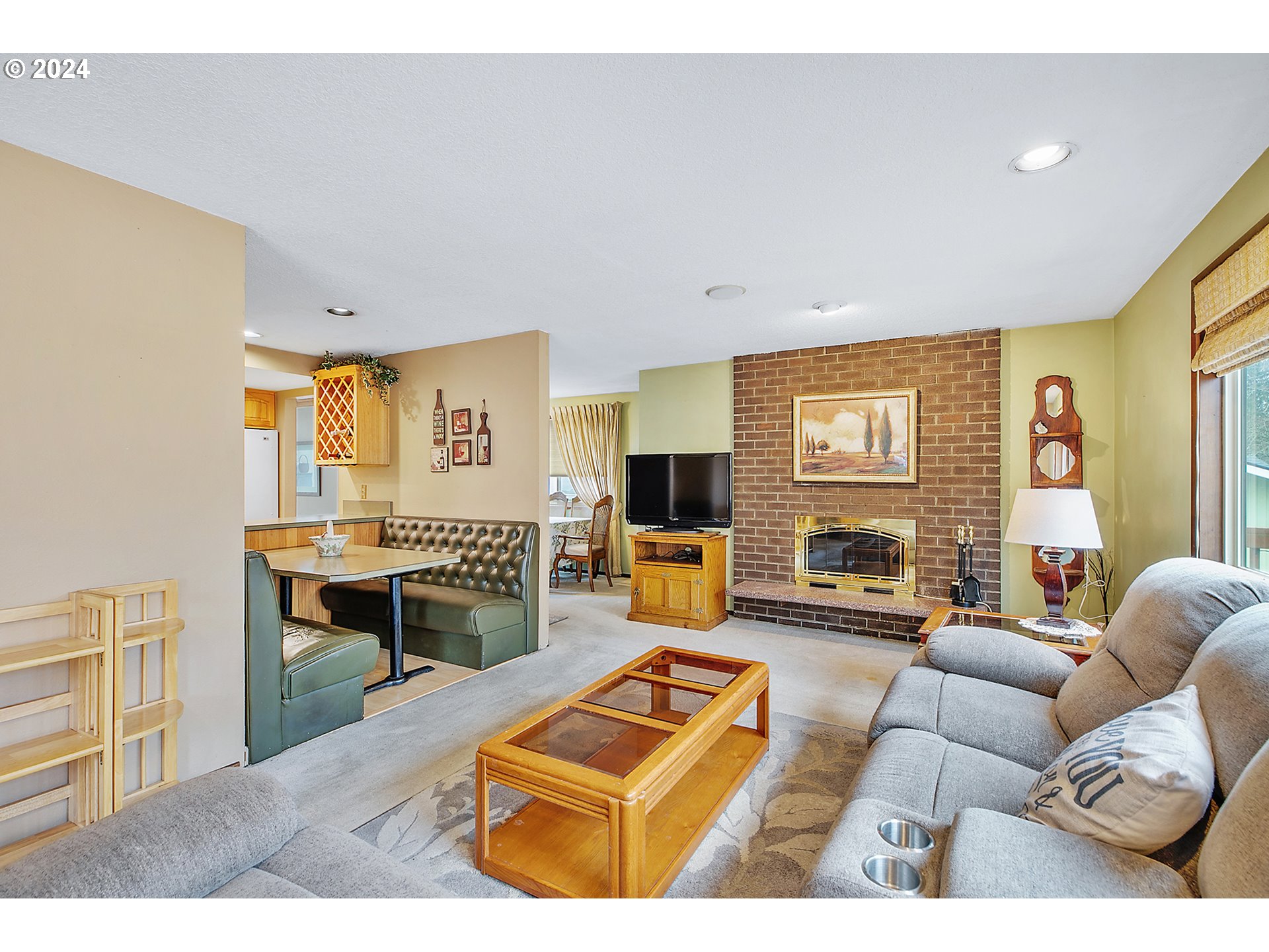 321 Northeast Scott Drive Gresham, OR 97030 - Photo 22 of 48 a living room with furniture a flat screen tv and a fireplace
