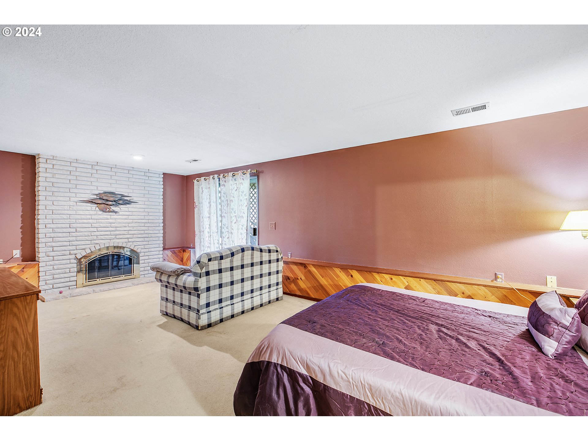 321 Northeast Scott Drive Gresham, OR 97030 - Photo 27 of 48 a bedroom with a bed and dresser with mirror