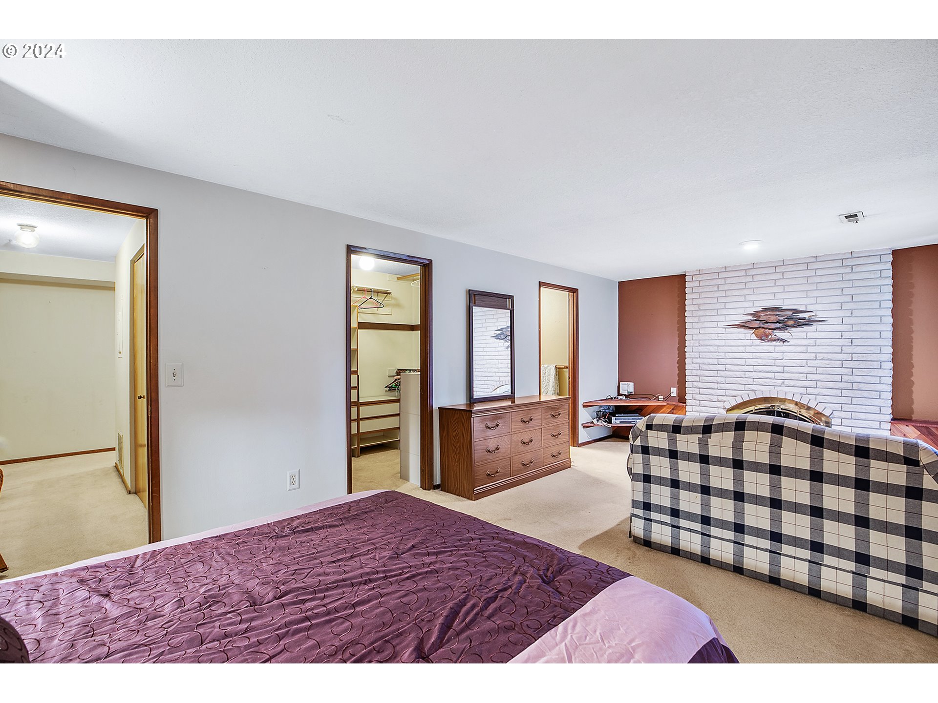 321 Northeast Scott Drive Gresham, OR 97030 - Photo 29 of 48 a bedroom with a bed and dresser with mirror