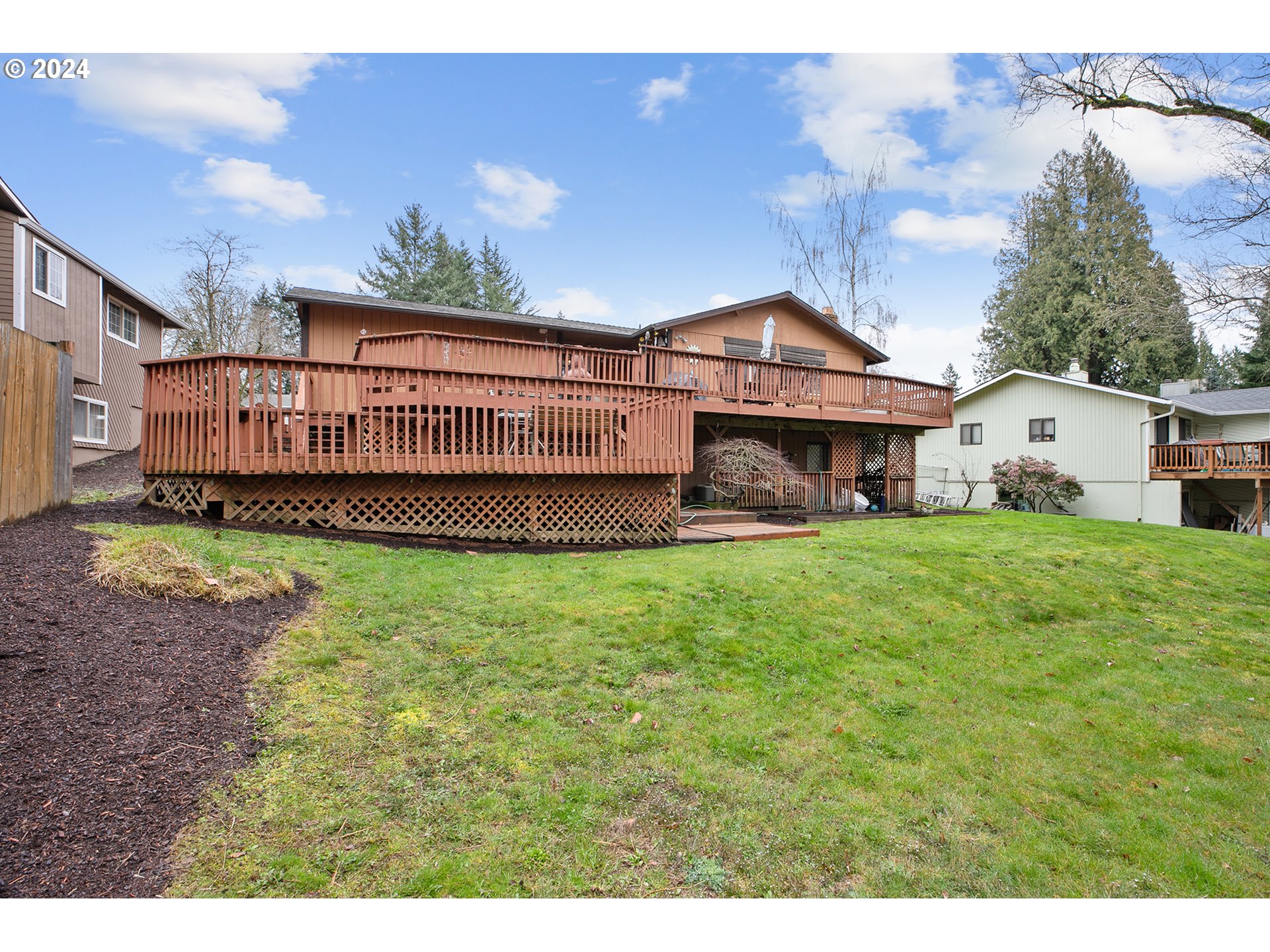 321 Northeast Scott Drive Gresham, OR 97030 - Photo 47 of 48 a view of a house with a yard and deck