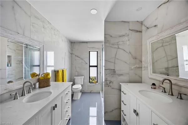 a bed room with a bed and a window