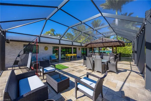 a view of a backyard with sitting area