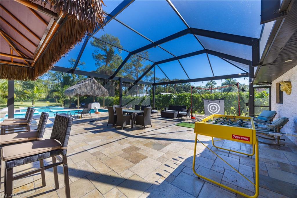 1890 Oakes Boulevard, Unit A Naples, FL 34119 - Photo 24 of 50 a view of a backyard with sitting area