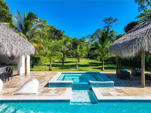 a view of a swimming pool with a patio