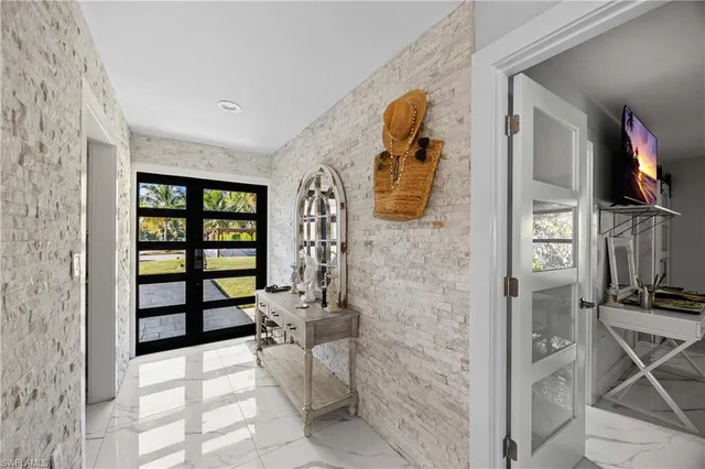 a kitchen with stainless steel appliances a stove sink and refrigerator